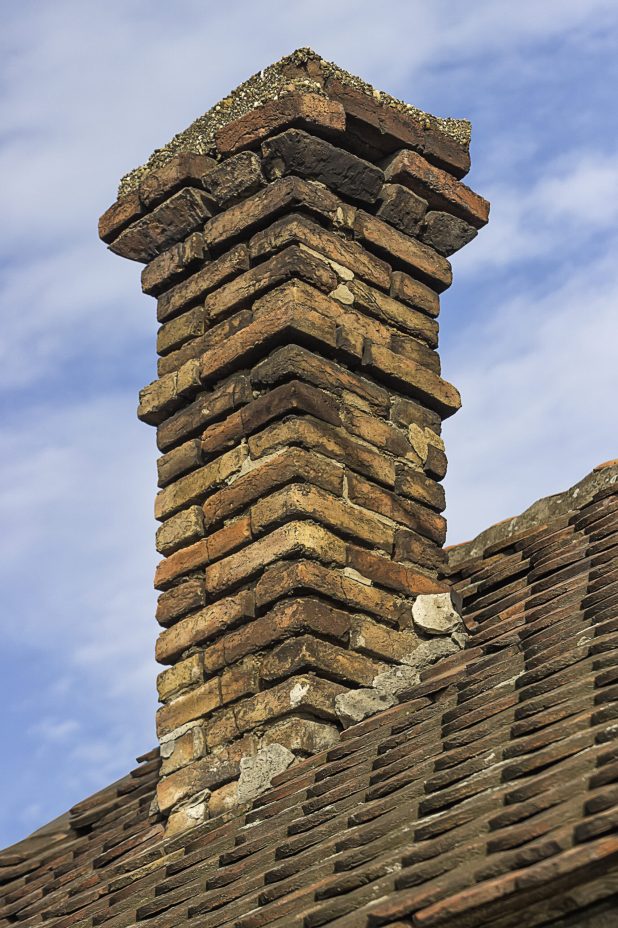 old-brick-chimney-with-old-tiles-roof-on-a-family-2026-01-11-09-01-13-utc
